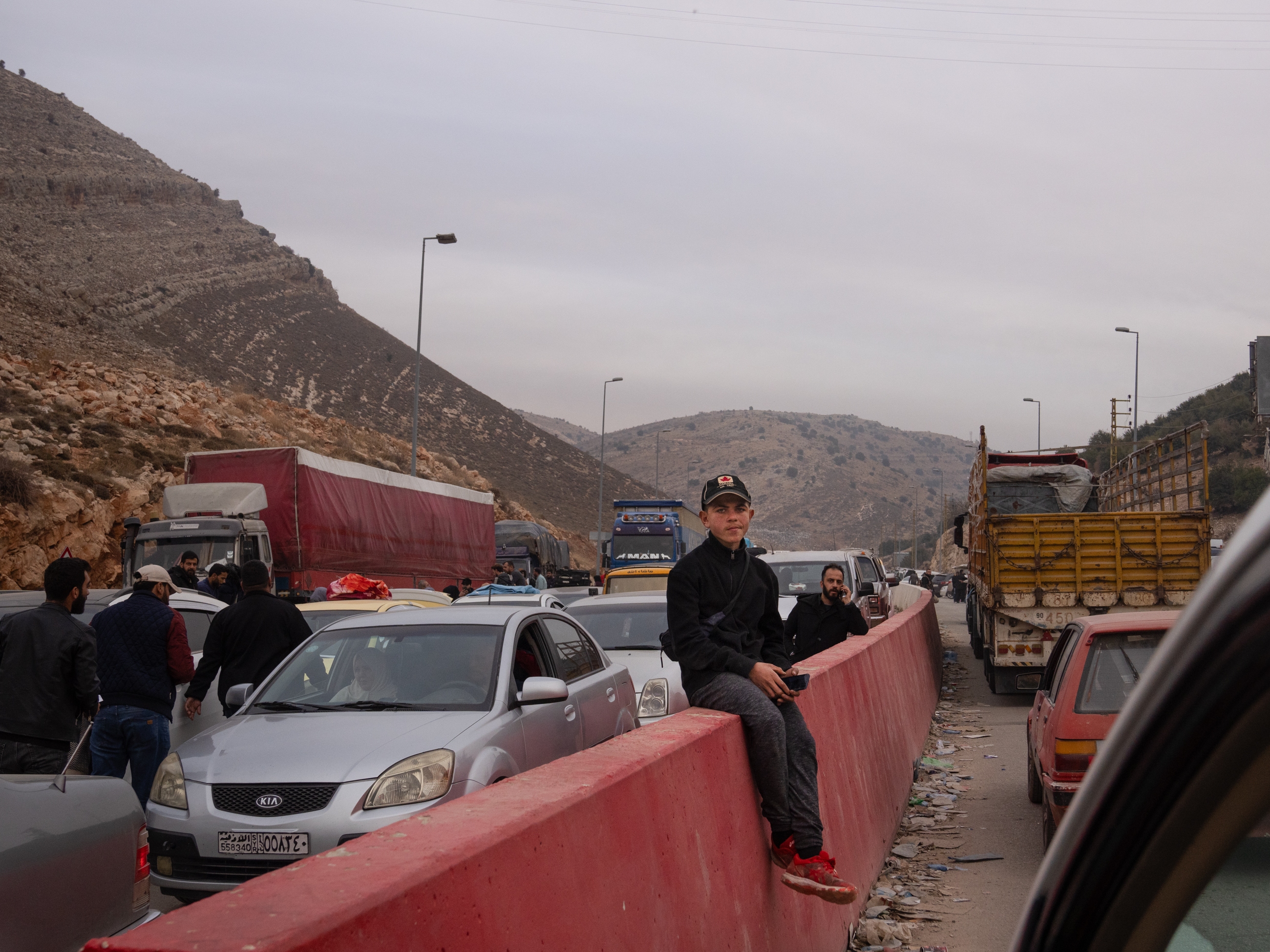 People wait in long lines to enter Lebanon from Syria at the Masnaa border crossing on Dec. 11. Many more than were heading in the other direction.