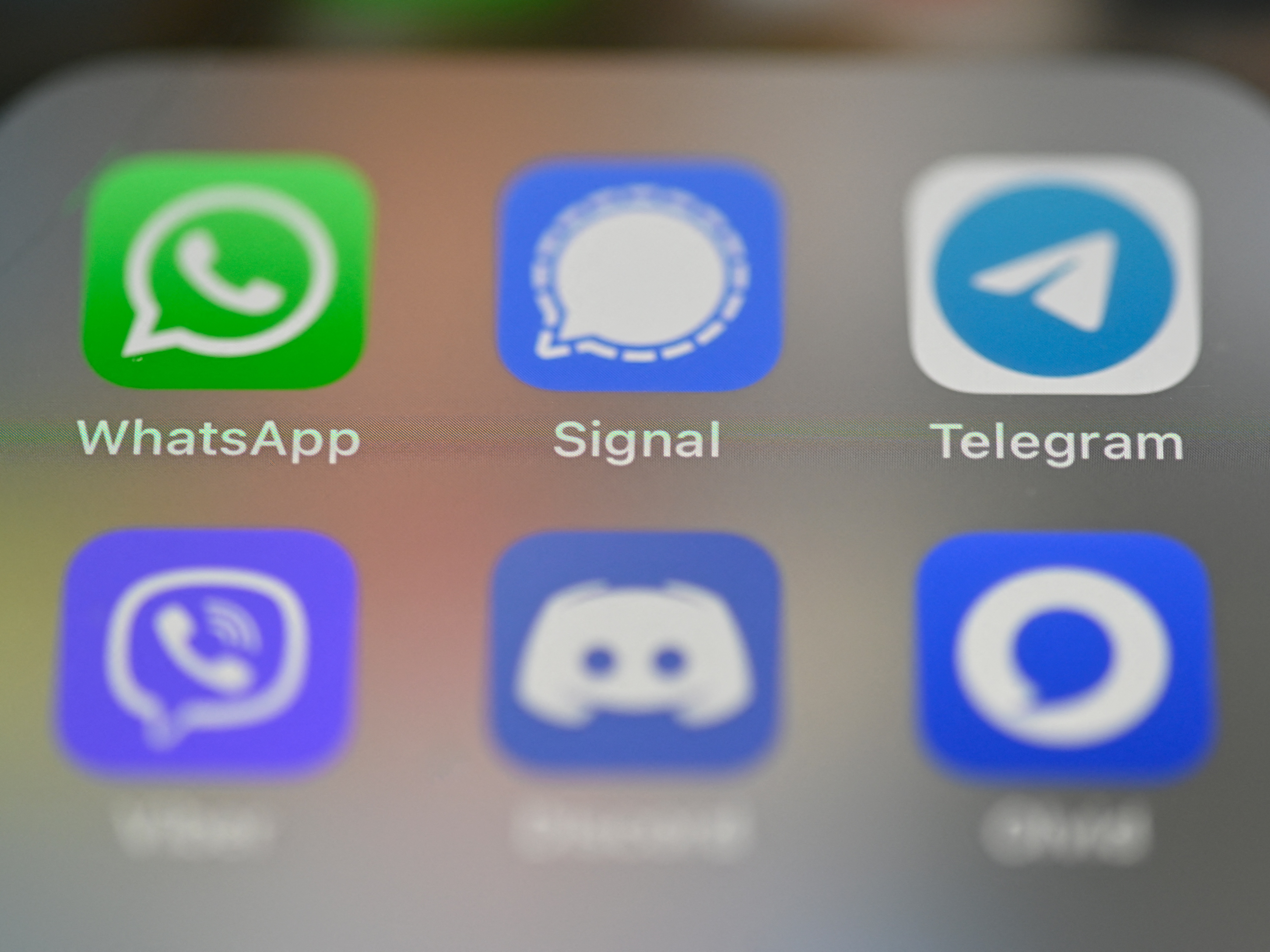 The FBI and other agencies are encouraging people to use end-to-end encryption, citing what they say is a sustained hacking operation linked to China. In this 2021 photo, a smartphone's screen shows messaging apps including WhatsApp, Signal and Telegram.