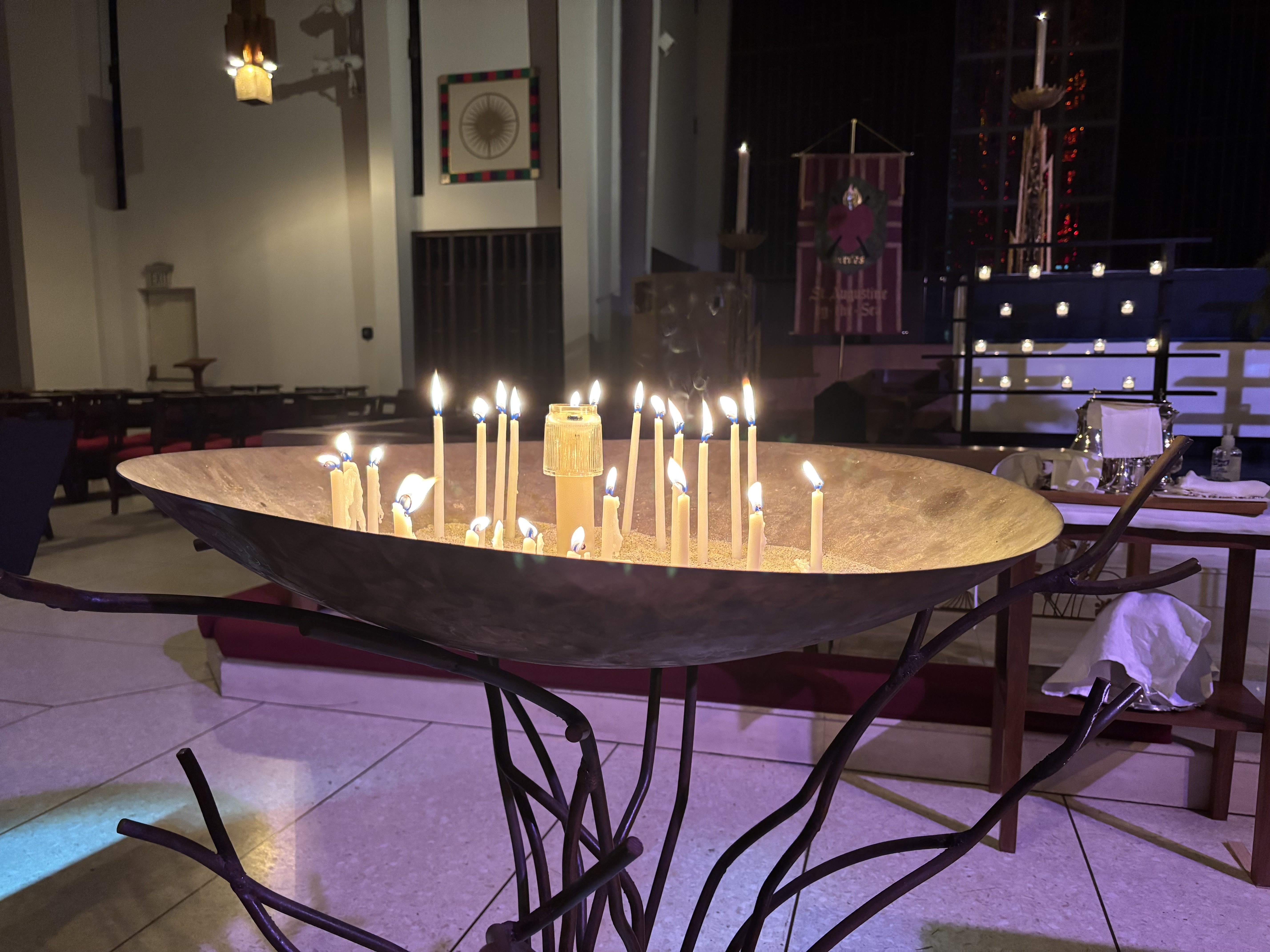 During St. Augustine by-the-Sea's annual Blue Christmas service, congregants light candles and pray for all the things that aren't right in their own lives and in the world.