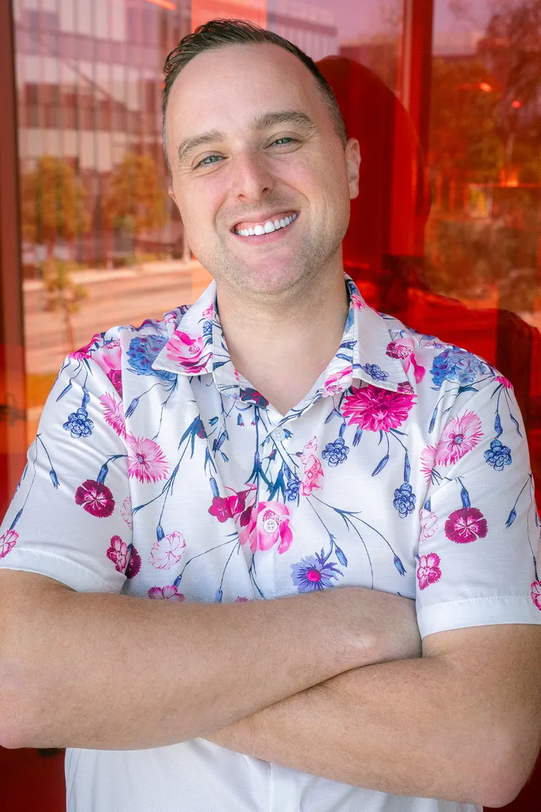 Man smiling in a button down shirt