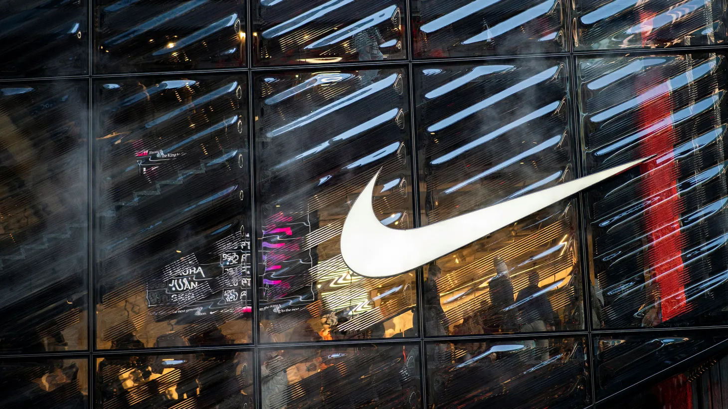 People visit the Nike store at 5th Avenue during the holiday season in New York City.