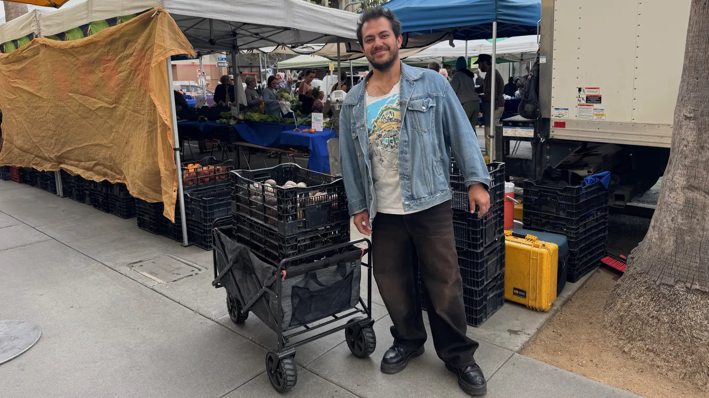 Balo Orozco hauls away 150 pounds of passionfruit from the Santa Monica Farmers' Market.